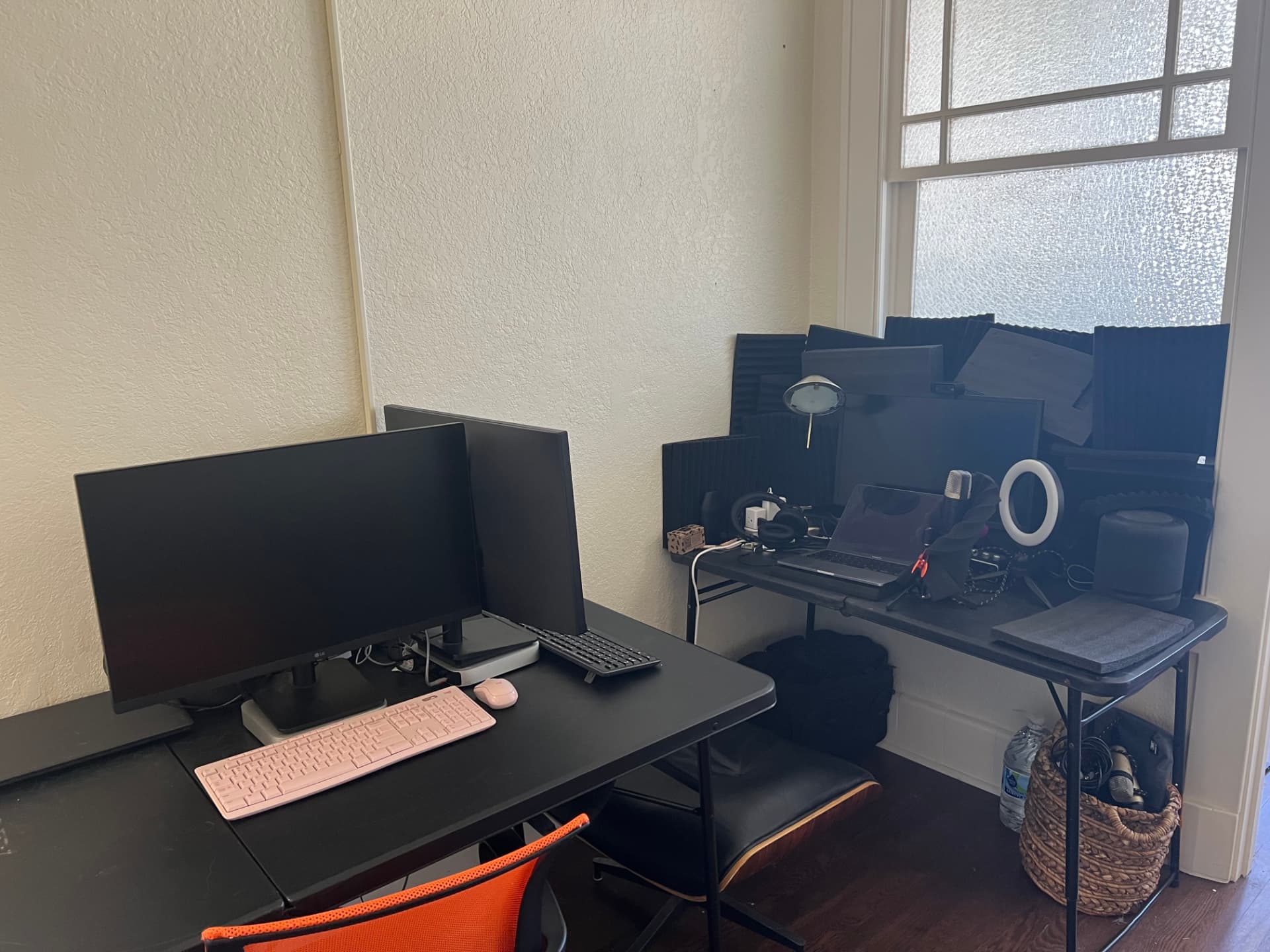 Dual-monitor coworking desk and recording corner with acoustic panels